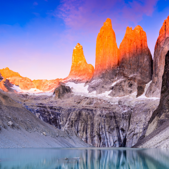 vivi & vela summit inspiration - towering snow-covered peaks glowing softly in warm light